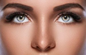 Close up of the beautiful young woman's upper face